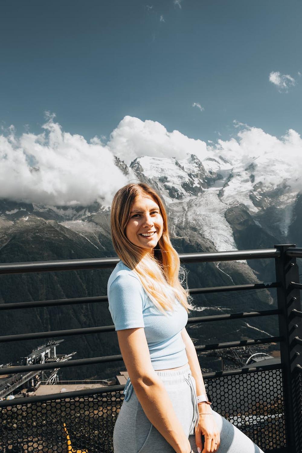 smiling_tourist_at_a_scenic_overlook_in_the_mounta